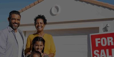 A happy family standing in front of a Scottsdale home for sale.